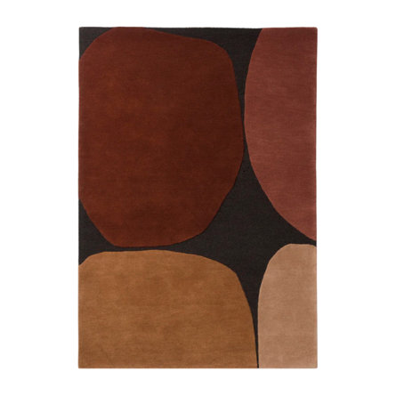 Abstract area rug with brown and tan shapes on black.