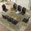 Oval Tempered Glass Dining Table with Gold Double Column Base and 8 Black PU Chairs, Ergonomic Backrest