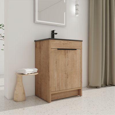 Meuble-lavabo autoportant de 24 po. Lavabo en céramique noire et 2 portes d'armoire à fermeture en douceur, poignée en métal, tablette réglable. Contreplaqué stable