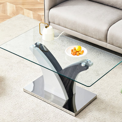 Table basse rectangulaire en verre trempé bicolore blanc et gris, avec dessus et pieds en verre transparent, idéale pour un bureau à domicile.