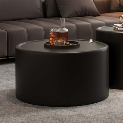 Table basse ronde avec plateau en verre trempé, structure en similicuir et rangement caché pour les salons modernes