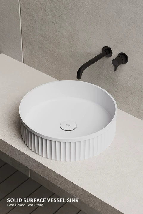 Modern white round ribbed solid surface vessel sink with matte black wall-mounted faucet, Solid Surface Vessel Sink, Less Splash Less Stains.