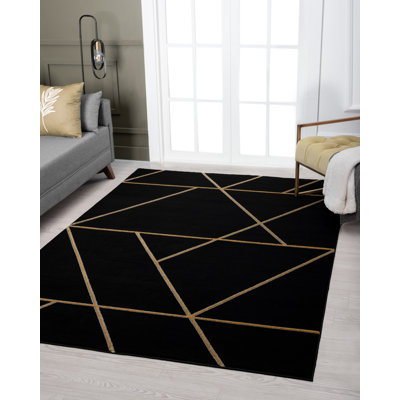 Tapis noir à motif géométrique Ezell
