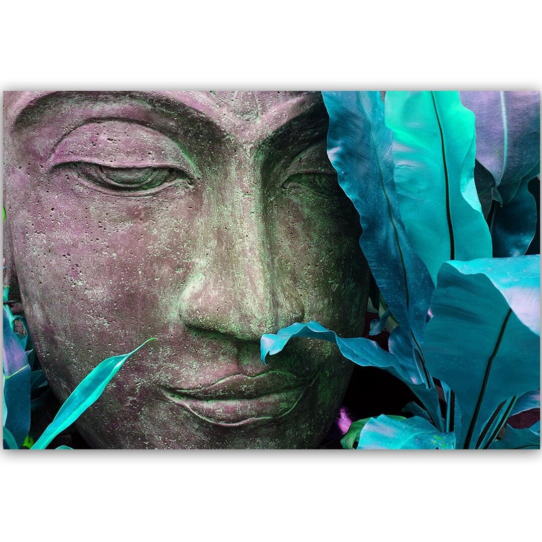 Leinwandbild Gesicht des Buddha mit Blatt