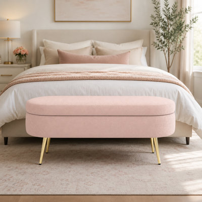 Pink flannel upholstered oval long storage stool equipped with metal legs, size 43.6"x16.1"x16"
