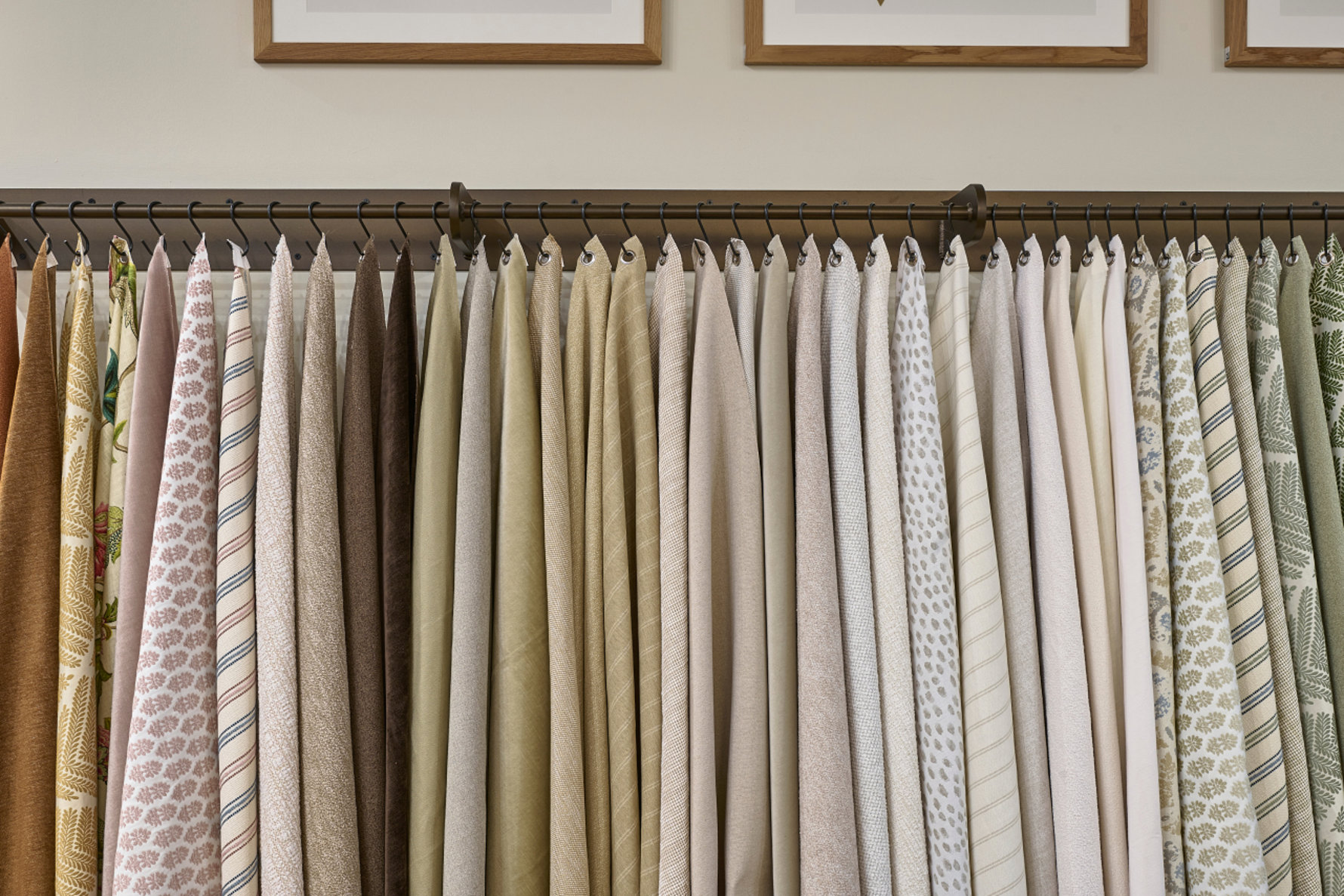 Fabric samples hanging on a rack.