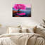 Arbre en fleurs rose vif sur une rive rocheuse avec la silhouette de la ville - Toile murale-1851250087