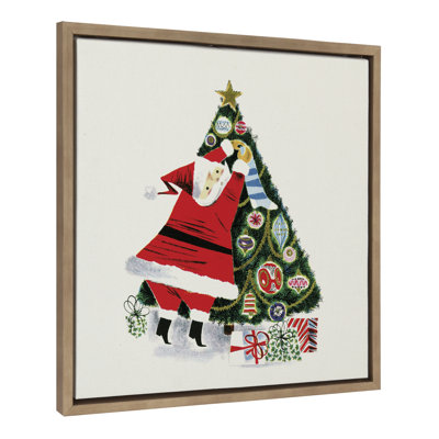 Santa Claus Decorating Tree by Corinna Buchholz of Piddix Framed Canvas Wall Art Print