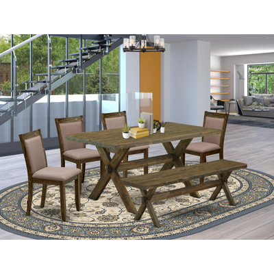 L'ensemble de table de salle à manger 6 pièces contient une table de salle à manger rectangulaire avec des pieds en X et 4 chaises Parson en tissu de café avec un banc, patiné