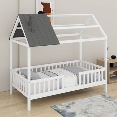 Lit simple en bois avec clôture