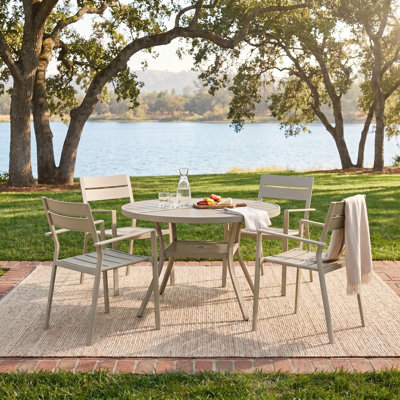 5-Piece Round Outdoor Dining Set With Stackable Metal Armchairs