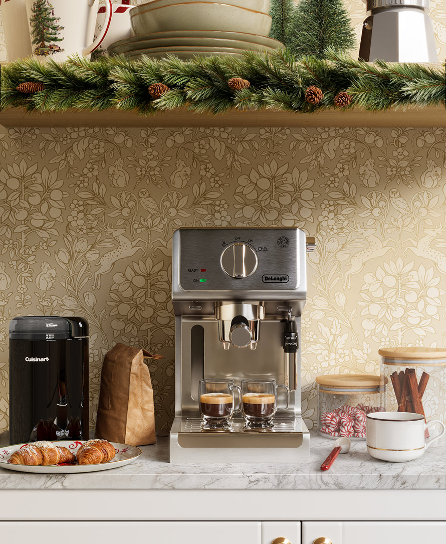 Delonghi espresso machine, Cuisinart grinder, croissants, and Christmas mug.