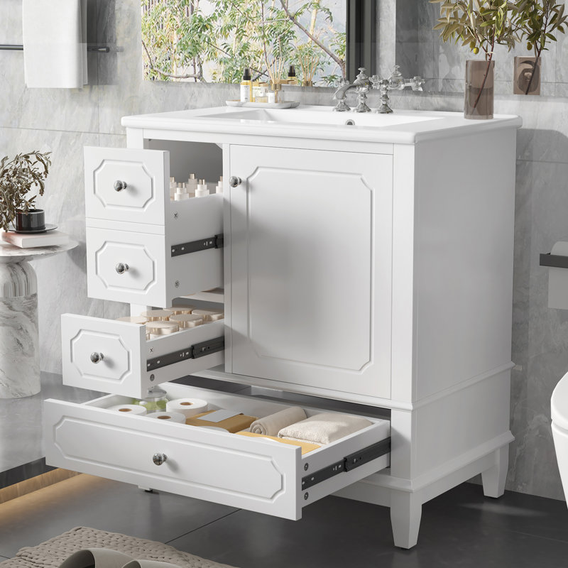 Meuble-lavabo autoportant avec lavabo en céramique, structure en bois massif, porte à fermeture en douceur, tiroirs et tablettes de rangement pour une vie pratique et élégante.