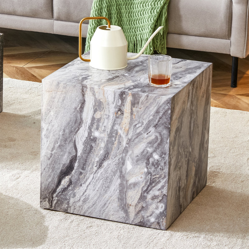 Elevate your living space with this modern MDF coffee table, which showcases grey textured patterns. It is characterized by stylish design.