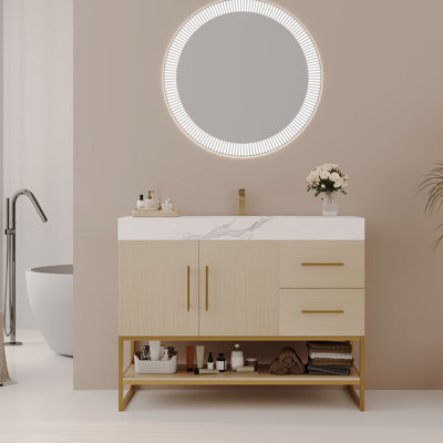 Meuble-lavabo moderne spacieux avec lavabo sans couture et accents dorés