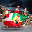 Grand père Noël volant d'un hélicoptère gonflable