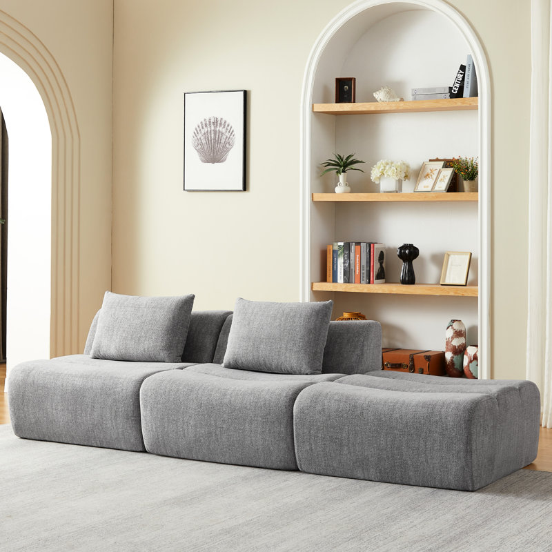Canapé 3 places compressé en chenille grise, livré monté, idéal pour appartement, confortable et peu encombrant, avec soutien en mousse et ressorts ensachés. Doux au toucher, design élégant, prêt à l'emploi.