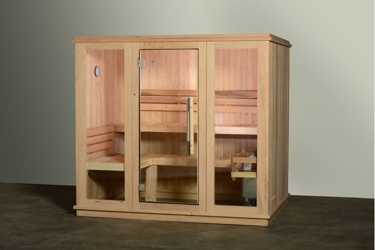 wood home sauna sitting on a tile floor in a bare room