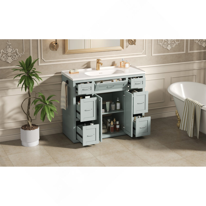 Meuble-lavabo 48 po vert menthe avec lavabo en céramique - 6 tiroirs (3 de chaque côté), tiroir central rabattable, portes doubles à fermeture en douceur, porte-serviettes latéral réversible, poignées argentées, panneau de fibres à densité moyenne