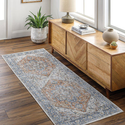 Tapis oriental en polyester tissé à la machine bleu foncé / rouille Bejarano Kirklin