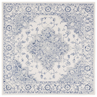 Metro Hand Tufted Wool/Cotton Oriental Rug in Ivory/Blue