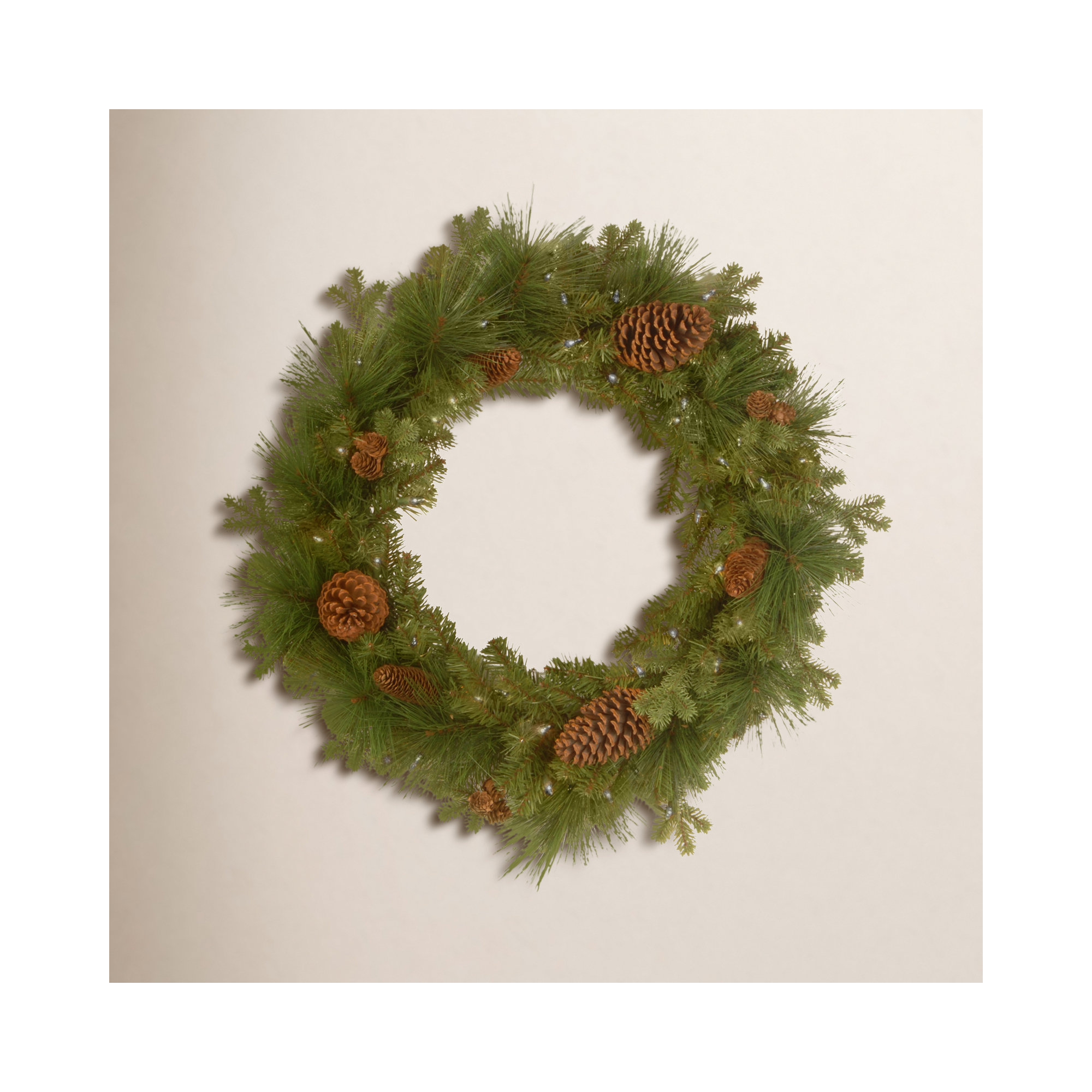 The Holiday Aisle® 24in. Eastwood Spruce Wreath with Battery Operated Warm White LED Lights