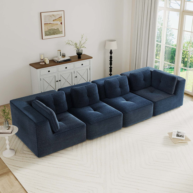 Canapé modulaire moderne Boneless avec assise profonde, tissu velours côtelé, conception capitonnée, sans assemblage et base antidérapante pour le confort du salon.