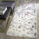 Makeba Floral Ivory/Gray/Purple Area Rug
