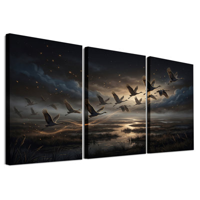 Flying Cranes at Dusk Over Wetlands Set Of 3 Canvas Wall Art