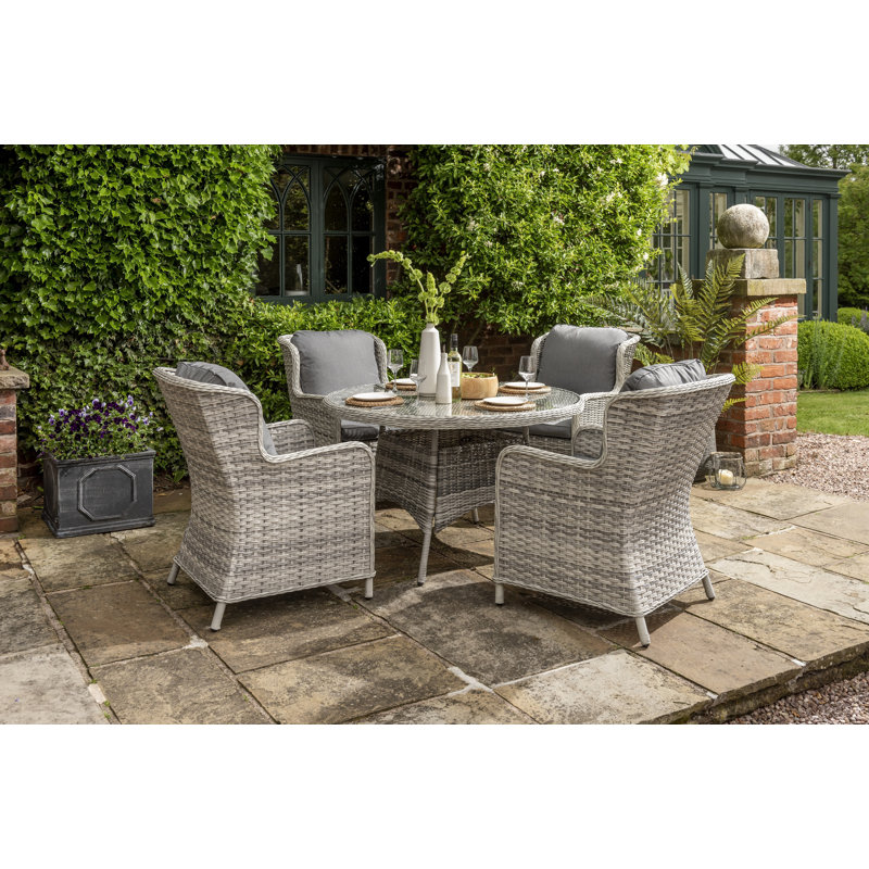 Addora 4 - Person Wicker Patio Dining Set with Round Table