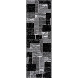 https://assets.wfcdn.com/im/62469178/resize-h310-w310%5Ecompr-r85/1463/146351607/jamaal-geometric-area-rug-in-grayblack.jpg