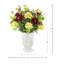 Composition de renoncules et d'hortensias dans un grand vase en pierre