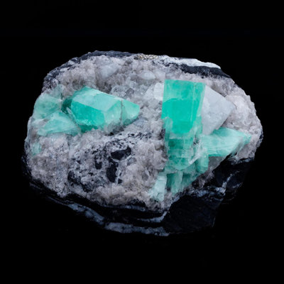 Émeraude sur calcite avec pyrite de Colombie
