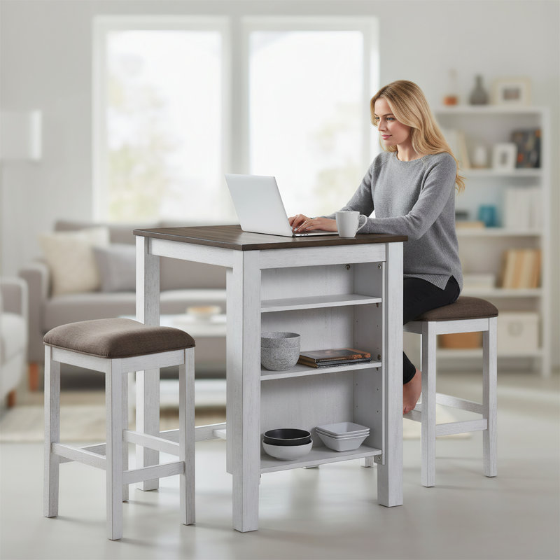 Un ensemble de salle à manger trois pièces conçu pour les espaces compacts, comprenant une table et deux tabourets.