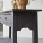 Thaki 51.18'' W Solid Wood Console Table