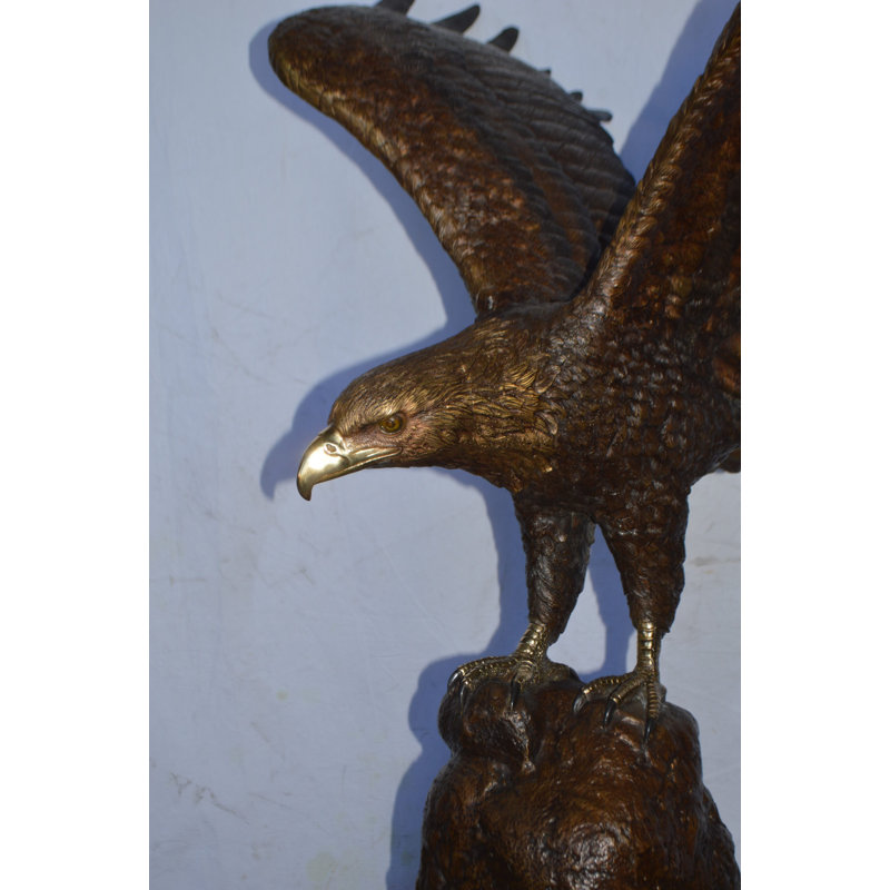 Eagle Landing On A Rock Bronze Statue - Size: 51"L X 36"W X 58"H.