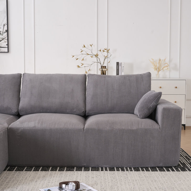 Canapé en forme de L moderne et confortable en velours côtelé pour des espaces polyvalents