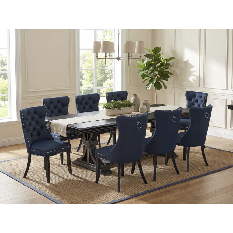 Cet ensemble de salle à manger moderne 9 pièces comprend une table de salle à manger et 8 chaises de cuisine en tissu de polyester bleu marine avec dossier capitonné à boutons - finition noir sablé.