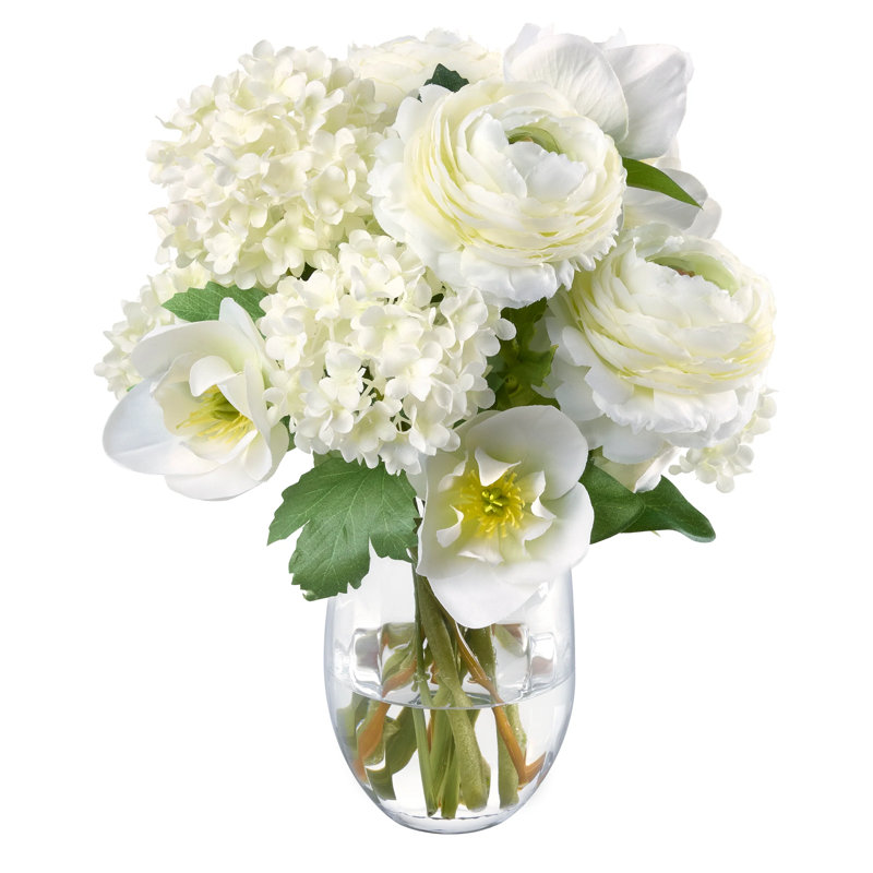 Bouquet d'Hellebore, Renoncule et Boule de neige dans un vase en verre