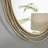 Rowden layered metal frame round mirror with a modern statement design