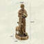 Statue de jardin religieuse représentant saint François, le protecteur de la nature avec mangeoire à oiseaux