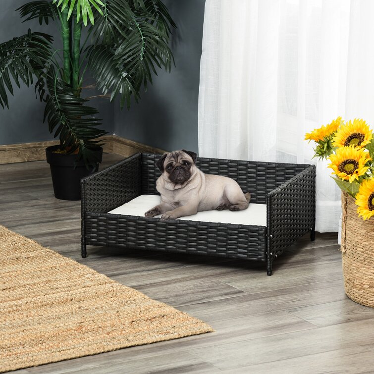 https://assets.wfcdn.com/im/62560174/resize-h755-w755%5Ecompr-r85/1637/163790856/Beneccio+Rattan+Bed+Raised+Wicker+Small+Animal+Indoor+%26+Outdoor+with+Soft+Water-Resistant+Cushion+Dog+Sofa.jpg