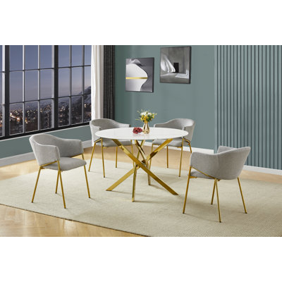 Ensemble de salle à manger rond en verre avec revêtement en marbre et fauteuils en lin
