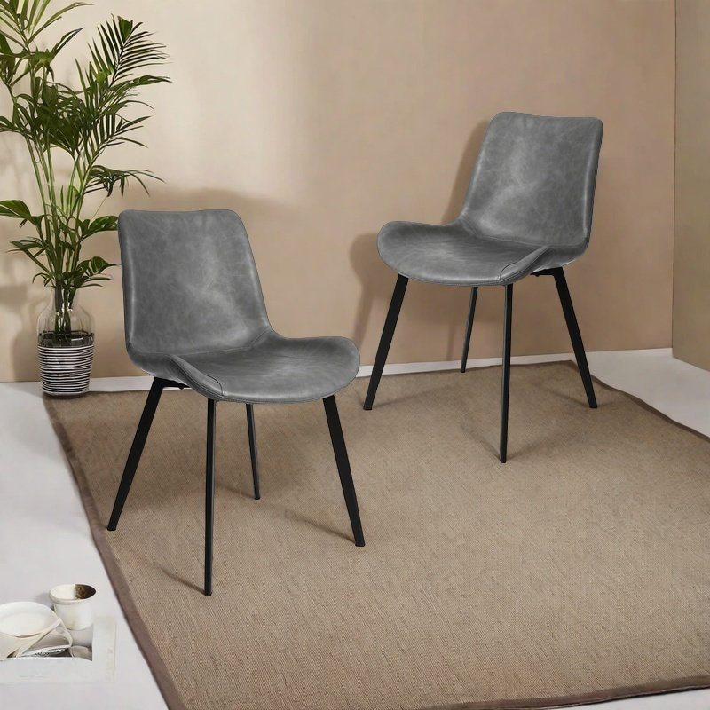 Chaises de salle à manger modernes en similicuir, chaises latérales sans accoudoirs avec dossier incurvé et pieds fuselés en métal noir, revêtement en similicuir, supportant jusqu'à 300 lb