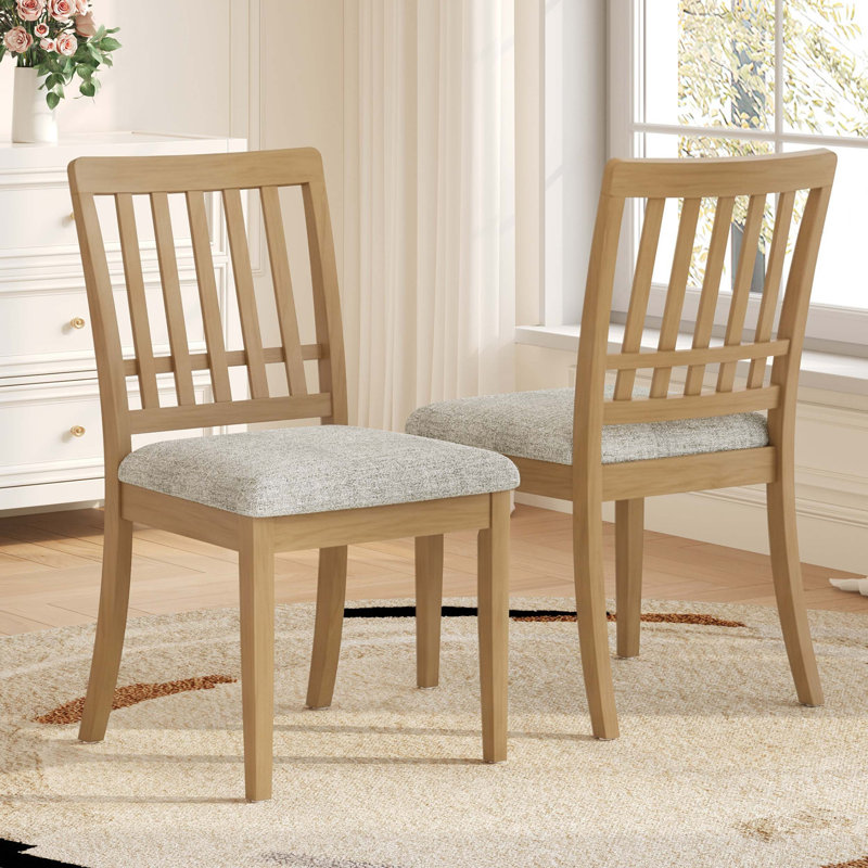 Chaises de salle à manger modernes scandinaves avec dossier courbé en bois et siège en tissu confortable pour la maison.