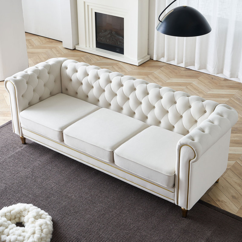 Canapé Chesterfield en velours à accoudoirs roulés Gevon, Beige