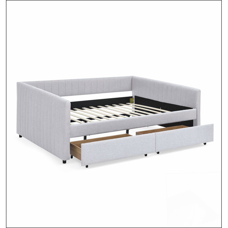 Grand lit beige avec rangement spacieux, parfait pour le confort et l'organisation moderne de la chambre à coucher