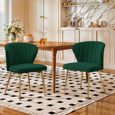 Chaise moderne en velours capitonné à dossier courbé avec pieds en métal
