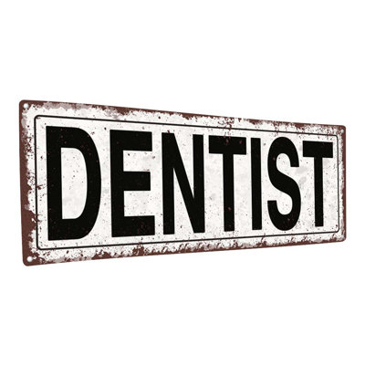 "Enseigne de dentiste en métal patiné"