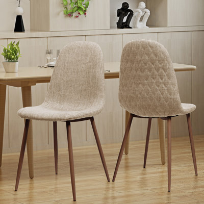 Élégante chaise de salle à manger en fer et en bois avec un tissu en polyester de qualité supérieure, idéale pour les repas à la maison